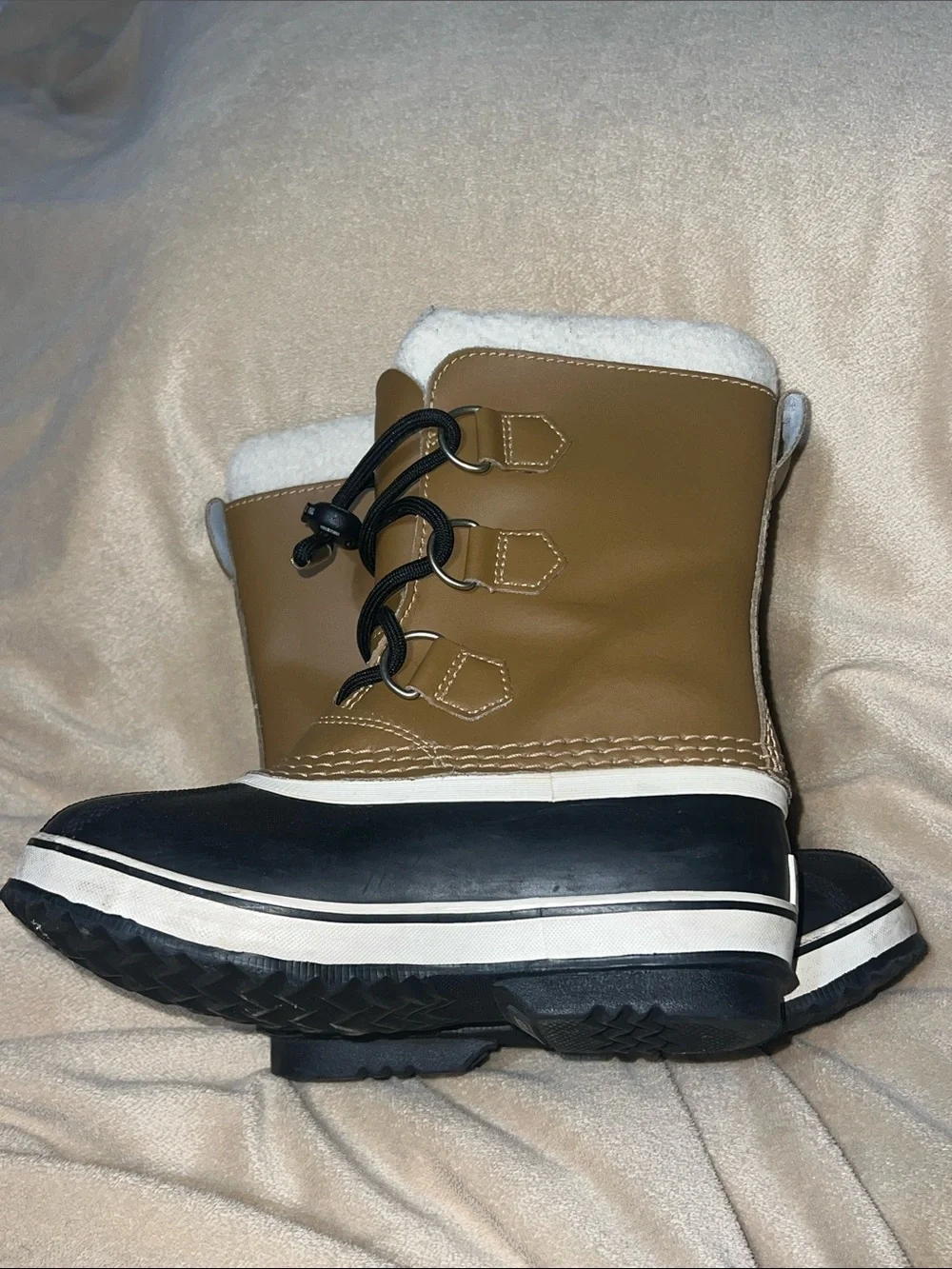 Sorel kids Tan and Black Waterproof Snow Boot with White Fleece Cuff- size 1